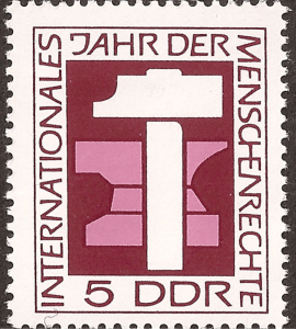 One of a number of East German postage stamps commemorating International Human Rights Year 1968. The hammer and anvil represent the right to work.